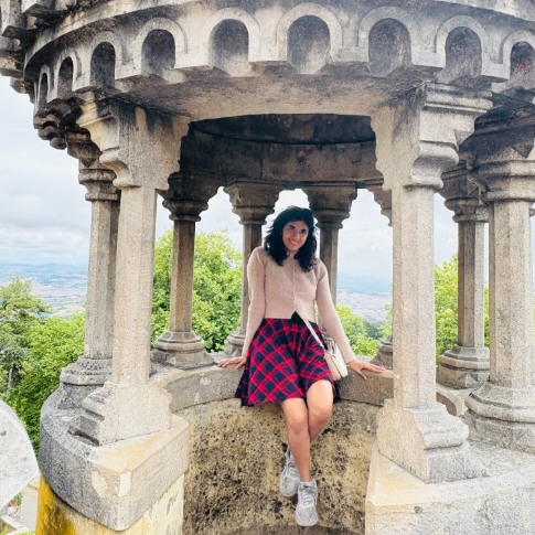 Student sitting in beautiful monument