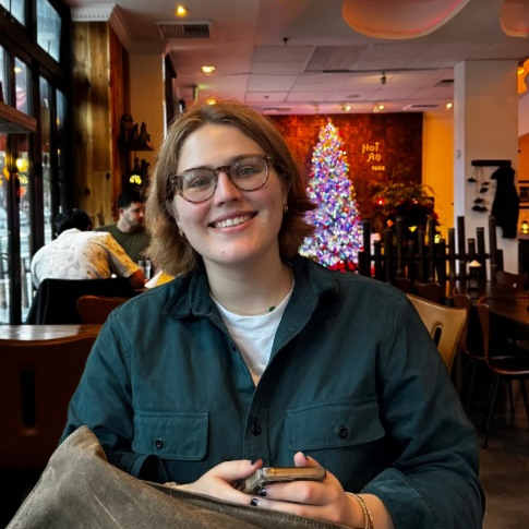 Student smiling at a restaurant
